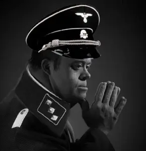 170591 - soybooru.com - arm bone bones cap closed_mouth clothes downs_syndrome eagle ear epaulettes eyebro...ay_skin grayscale hair hands hat hat_ornament lips looking_to_the_right military_cap military_uniform nazism nose not_oc r.jpg